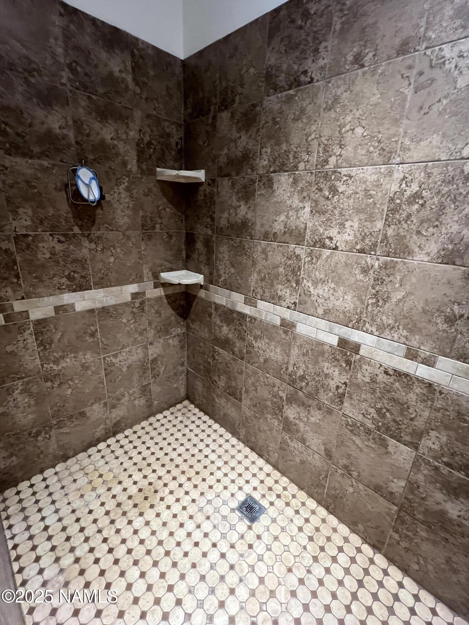665 Dust Devil Drive Parks, AZ 86005 - Photo 22 of 44 a bathroom with a shower