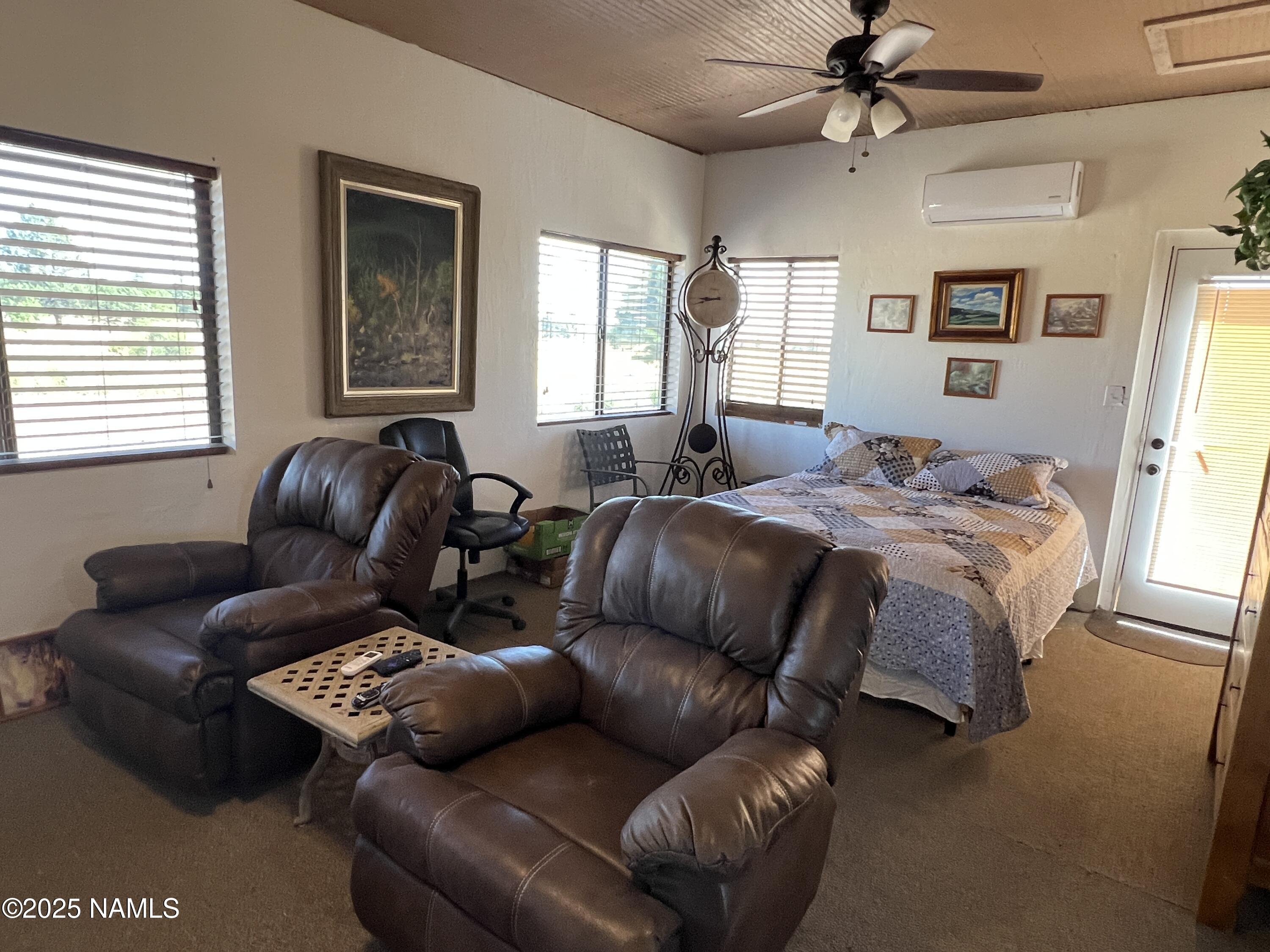 665 Dust Devil Drive Parks, AZ 86005 - Photo 23 of 44 a bed room with couch and a window