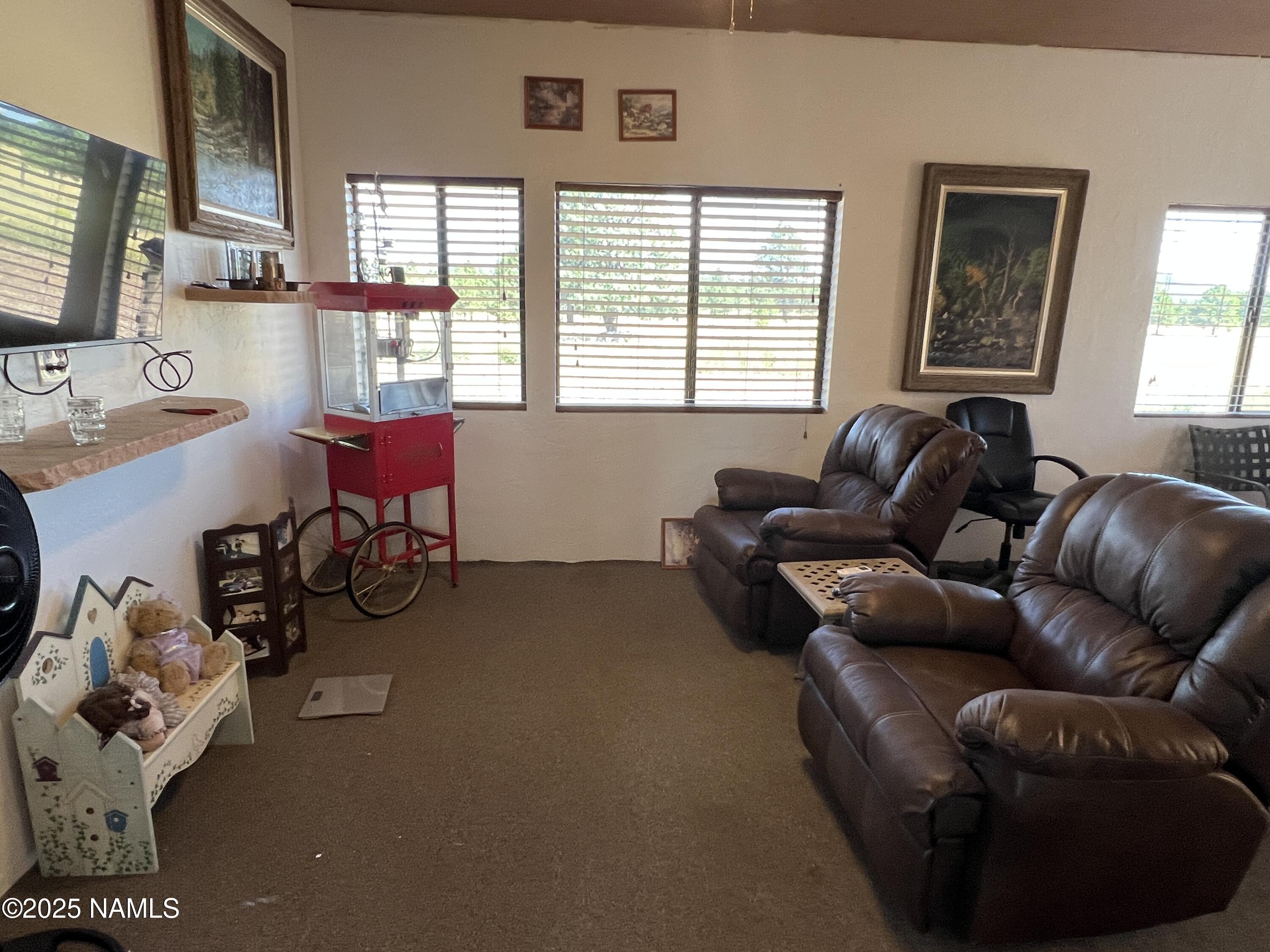 665 Dust Devil Drive Parks, AZ 86005 - Photo 24 of 44 a living room with furniture and a window