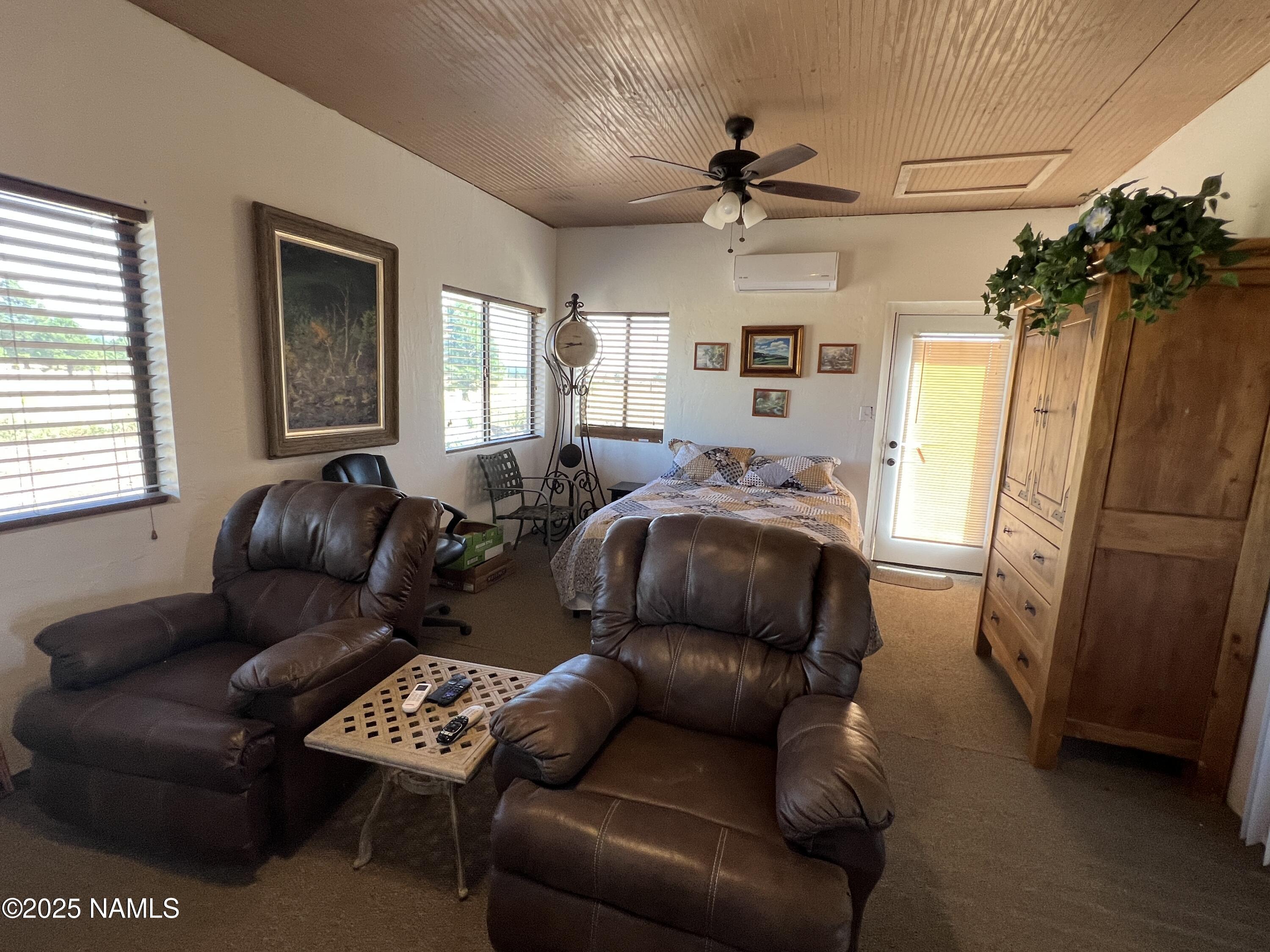 665 Dust Devil Drive Parks, AZ 86005 - Photo 25 of 44 a living room with furniture and a window