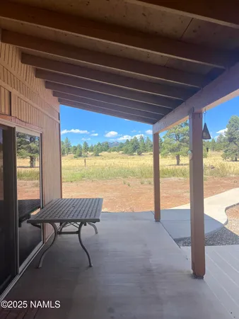 a view of a yard covered in snow
