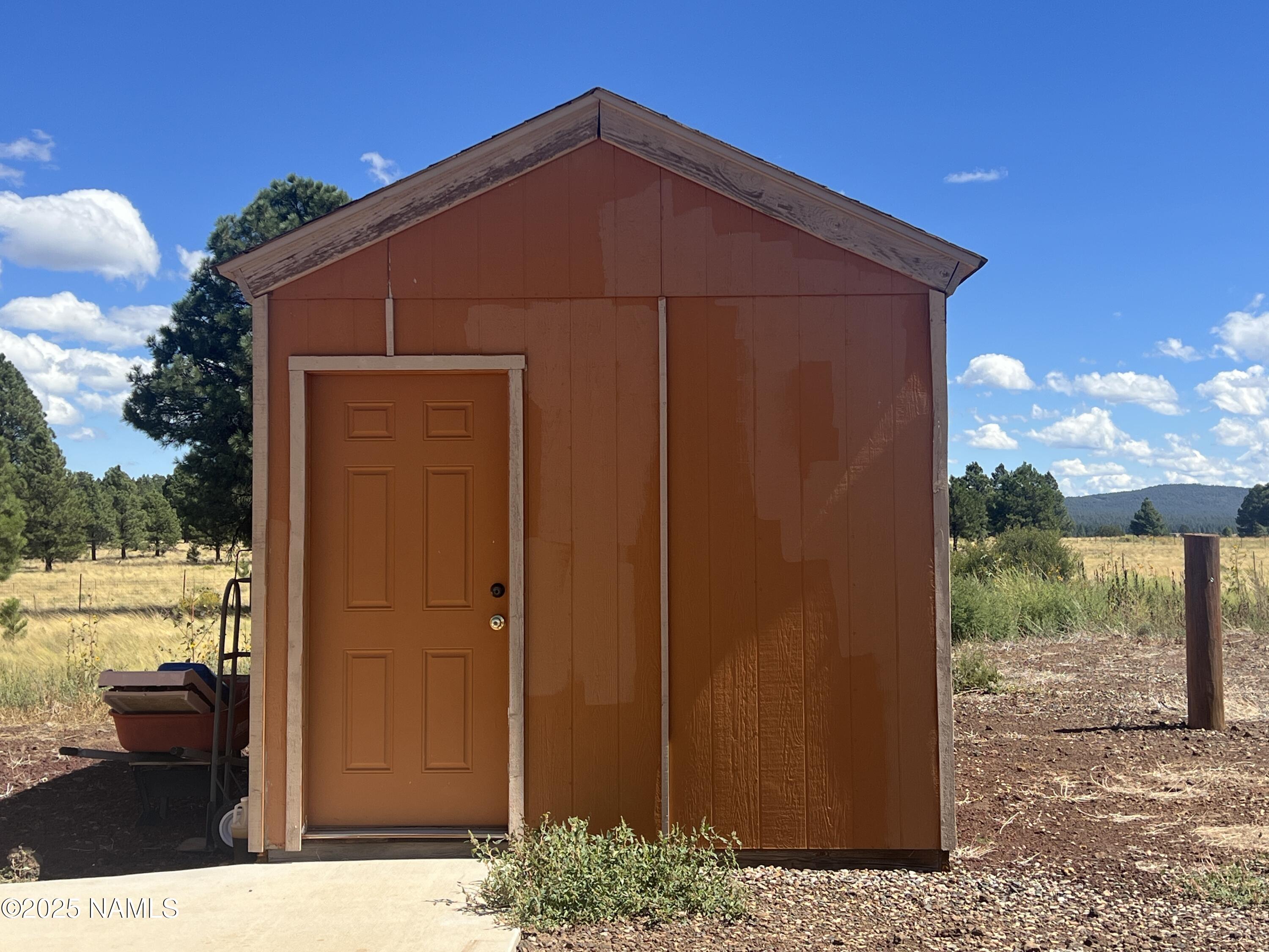 665 Dust Devil Drive Parks, AZ 86005 - Photo 29 of 44 a blue house with outdoor space