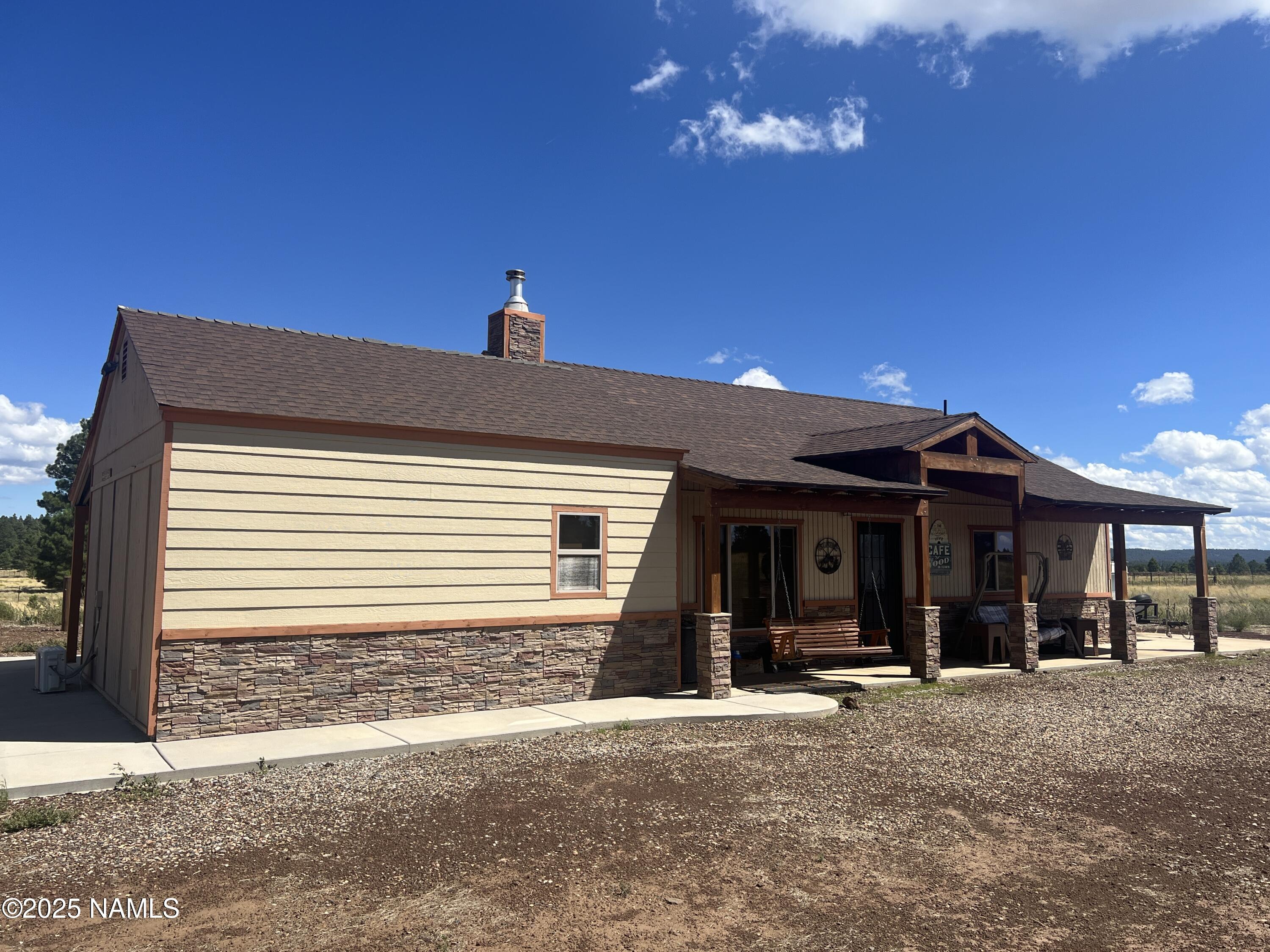 665 Dust Devil Drive Parks, AZ 86005 - Photo 6 of 44 a front view of a house