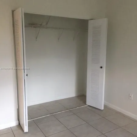 a bathroom with a granite countertop toilet a sink and bathtub