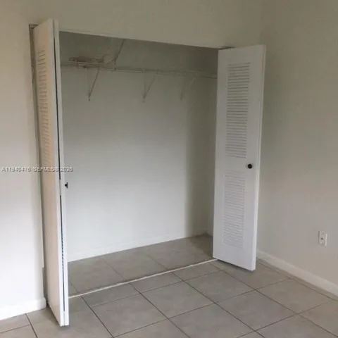 a bathroom with a granite countertop toilet a sink and bathtub