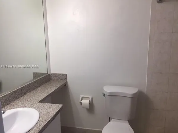 a kitchen with stainless steel appliances granite countertop a refrigerator stove microwave and sink