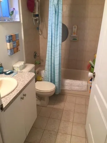 a bathroom with a toilet a sink and a mirror