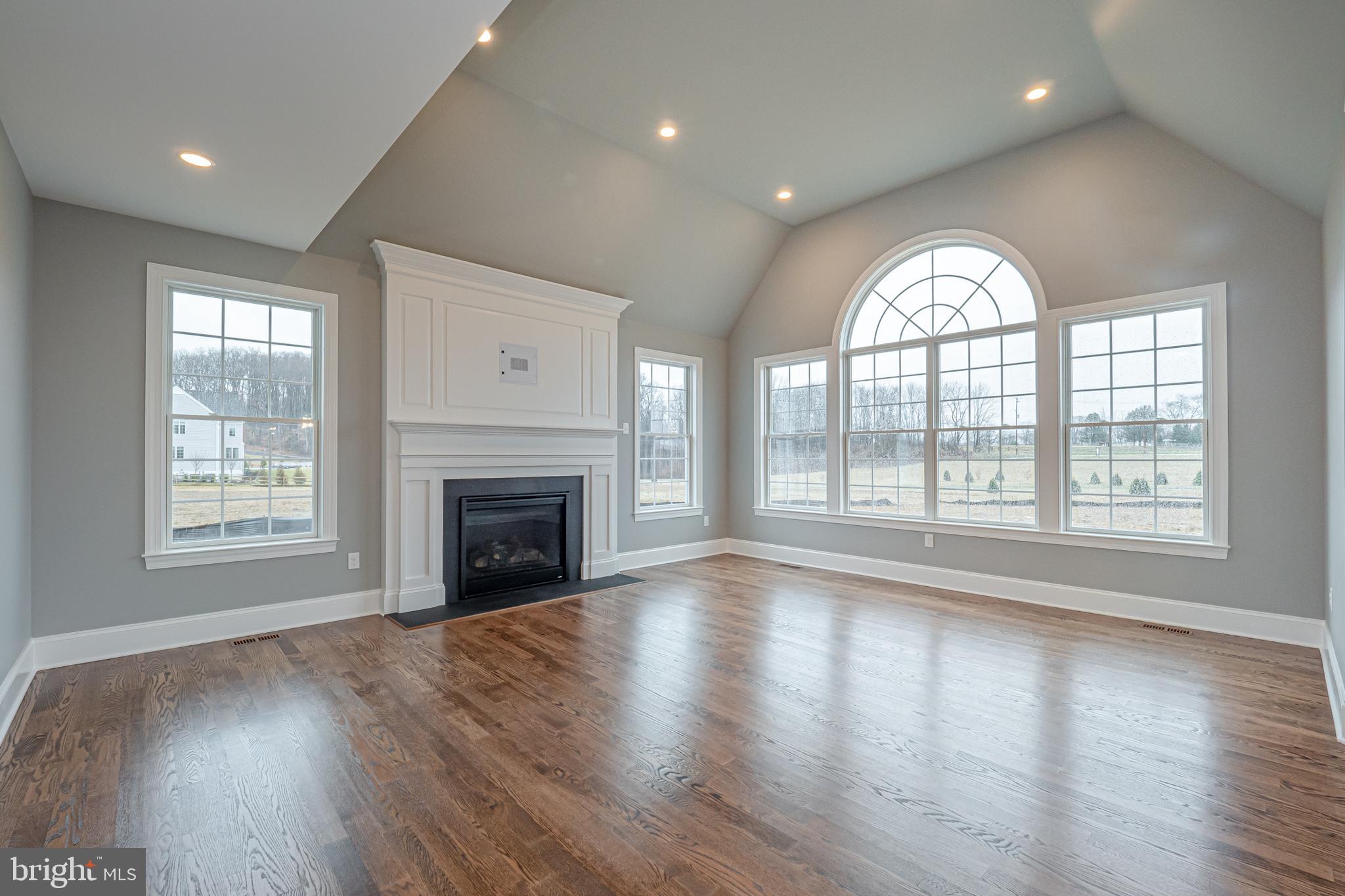 Lot C Howell Road Malvern, PA 19355 - Photo 25 of 61 an empty room with wooden floor windows and fireplace