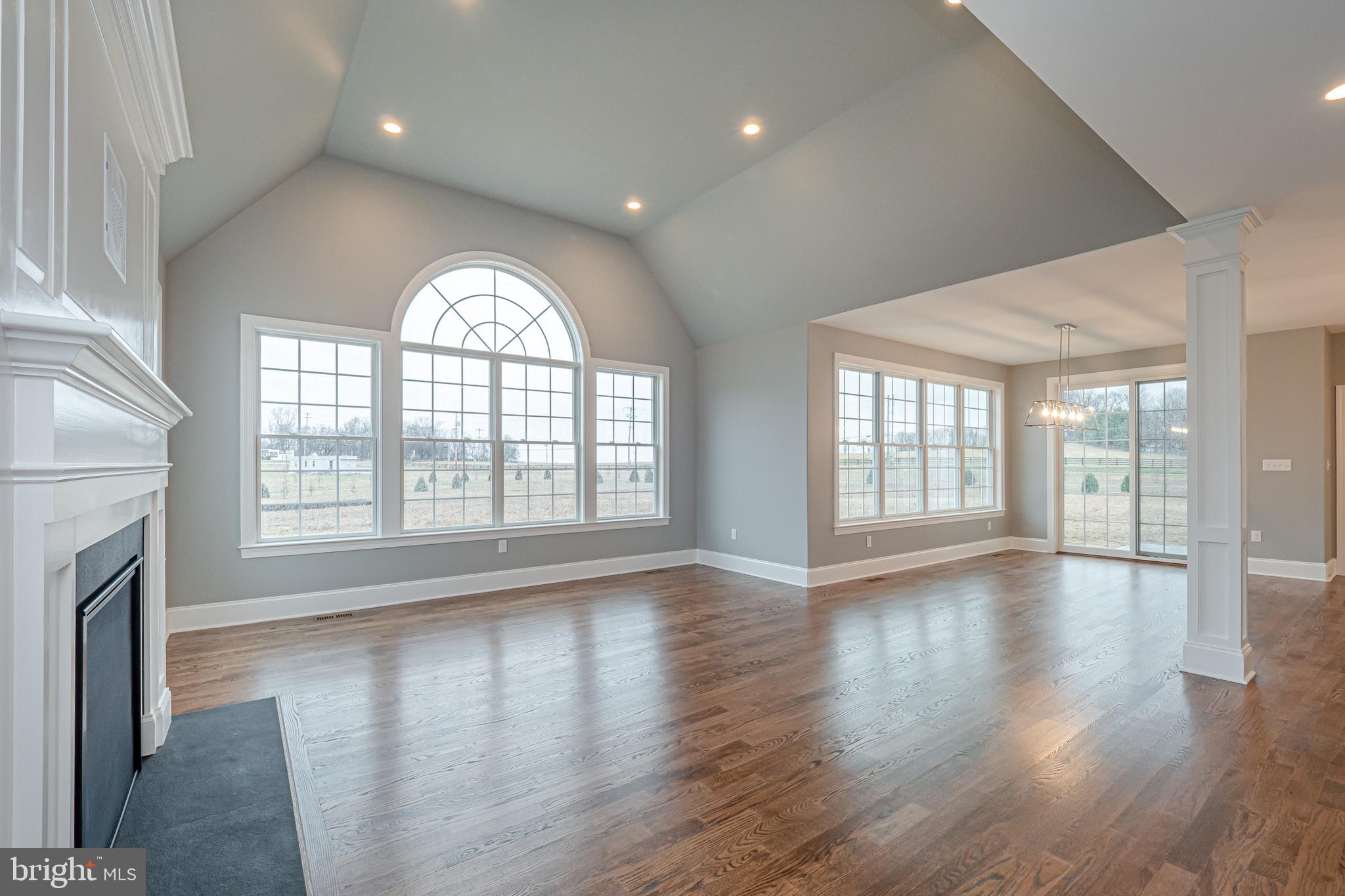 Lot C Howell Road Malvern, PA 19355 - Photo 26 of 61 an empty room with wooden floor and a fireplace