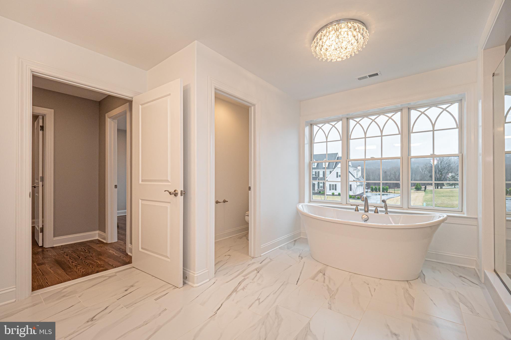 Lot C Howell Road Malvern, PA 19355 - Photo 42 of 61 a living room with a large window and chandelier