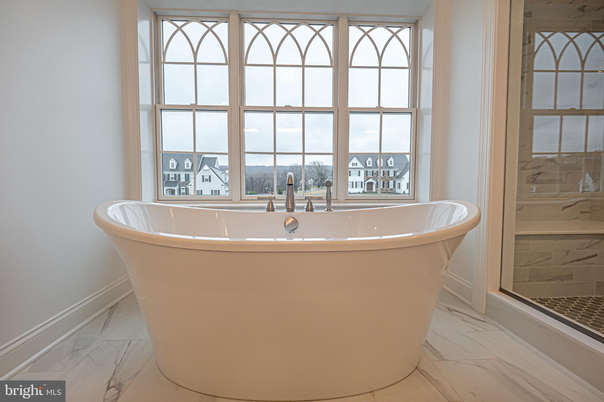 Lot C Howell Road Malvern, PA 19355 - Photo 43 of 61 a white bath tub sitting in a bathroom next to a window