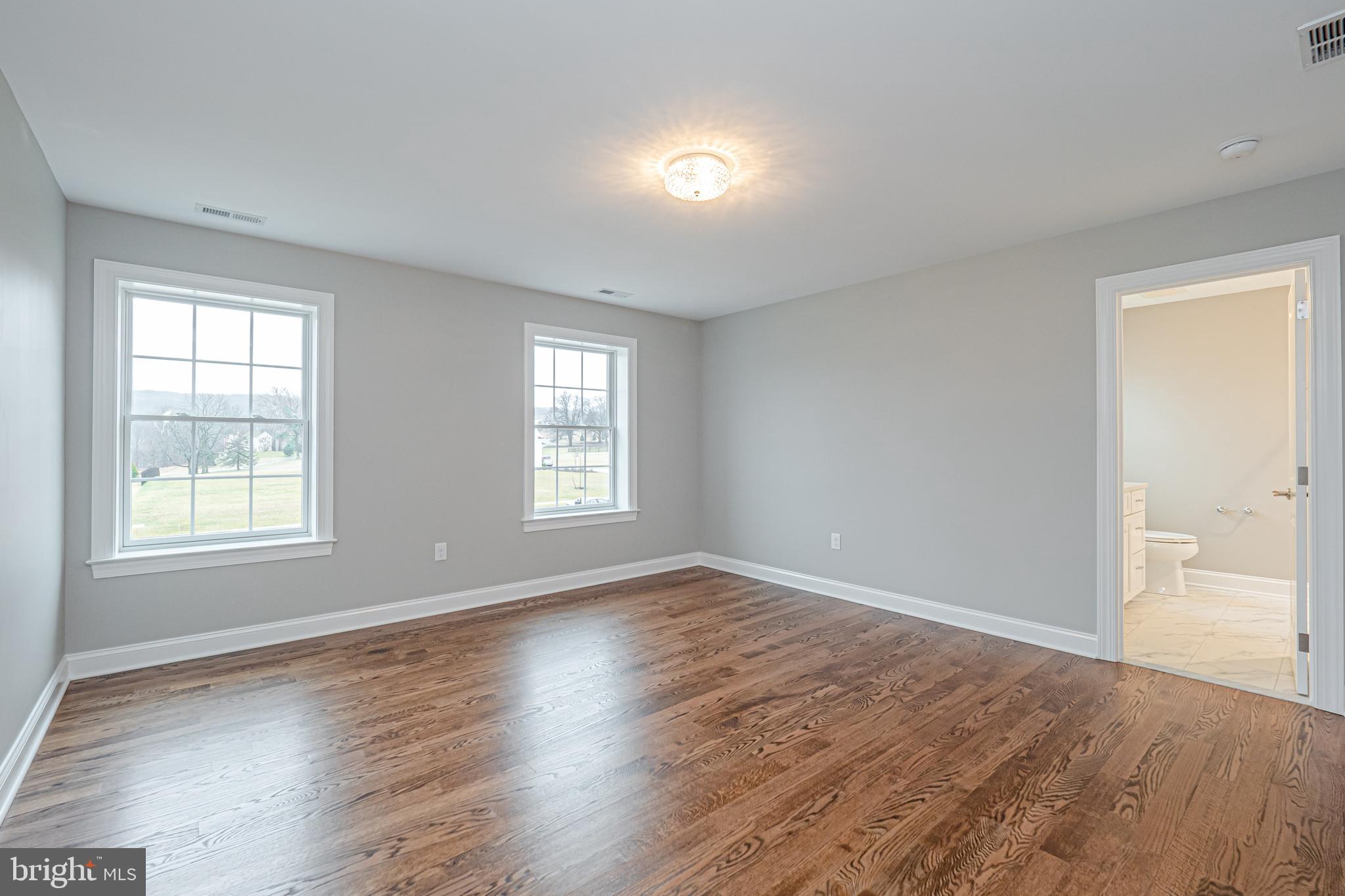 Lot C Howell Road Malvern, PA 19355 - Photo 47 of 61 an empty room with wooden floor and windows