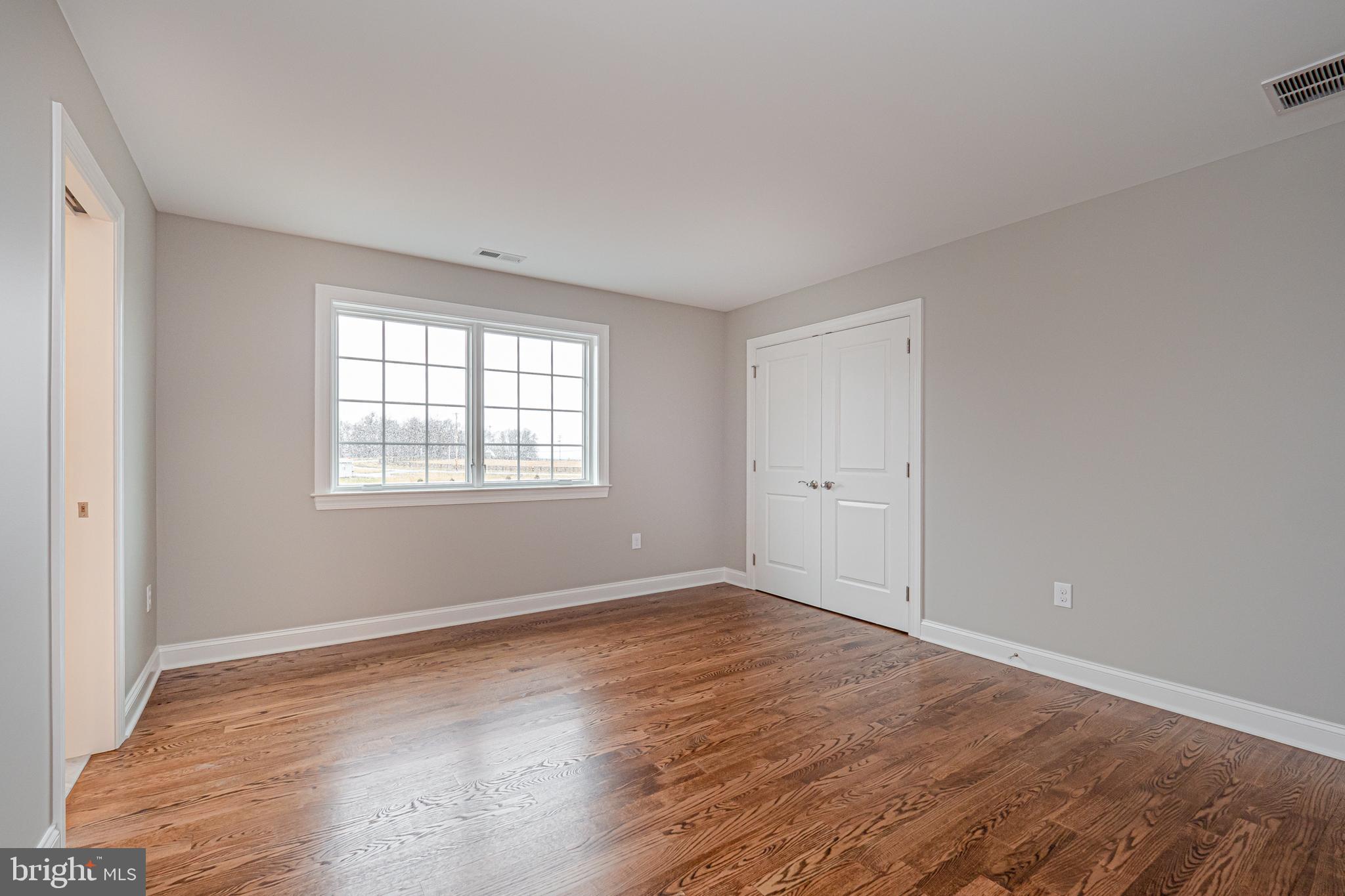 Lot C Howell Road Malvern, PA 19355 - Photo 49 of 61 a view of an empty room with wooden floor and a window