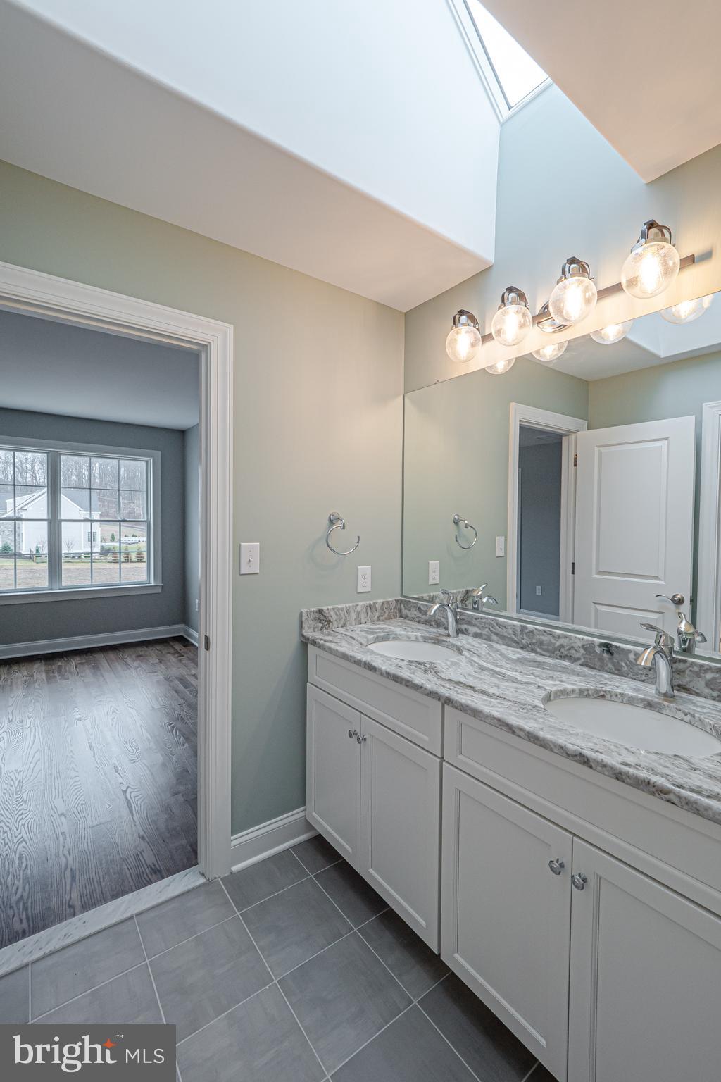 Lot C Howell Road Malvern, PA 19355 - Photo 54 of 61 a bathroom with a double vanity sink and a mirror