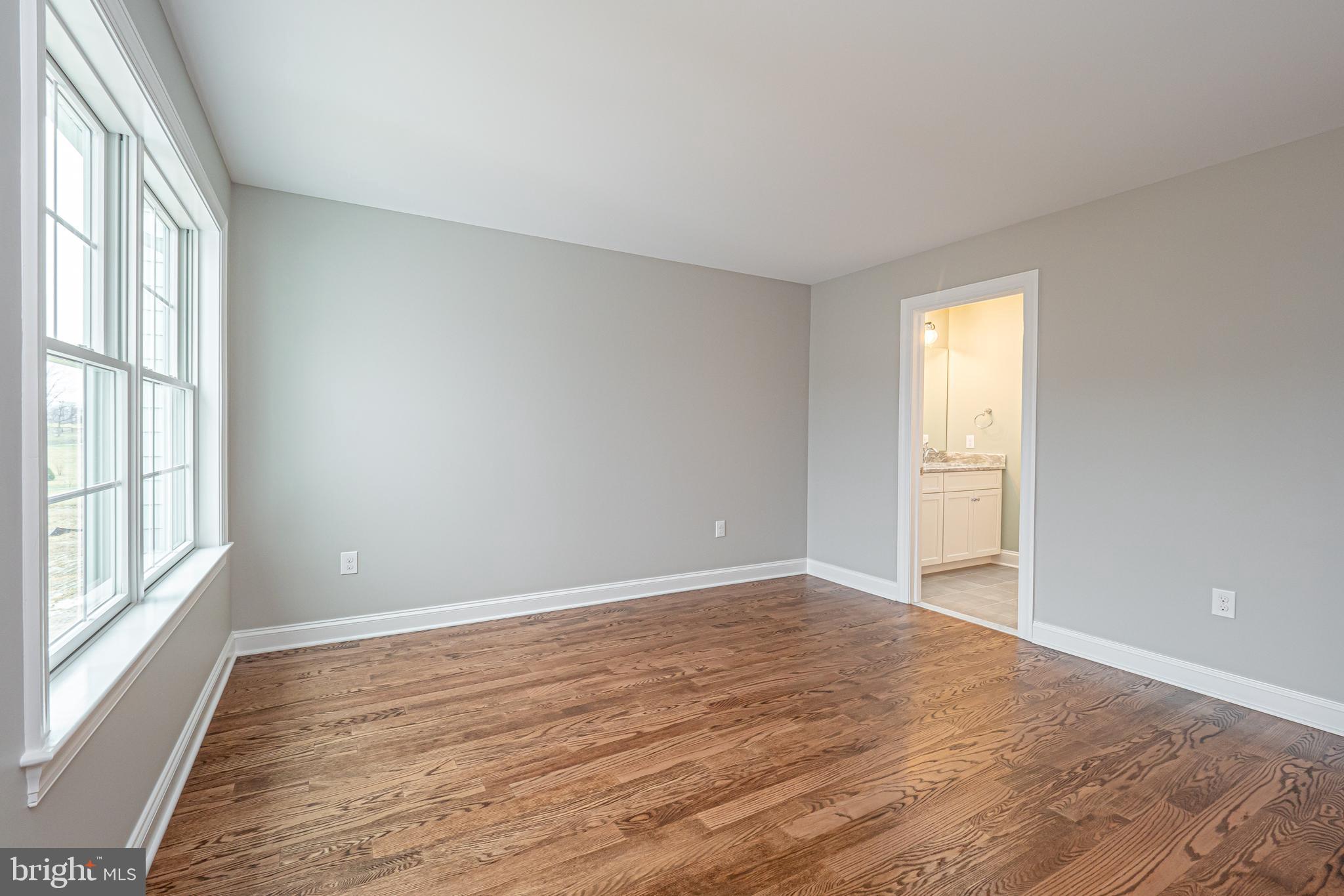 Lot C Howell Road Malvern, PA 19355 - Photo 56 of 61 a view of an empty room with wooden floor and a window