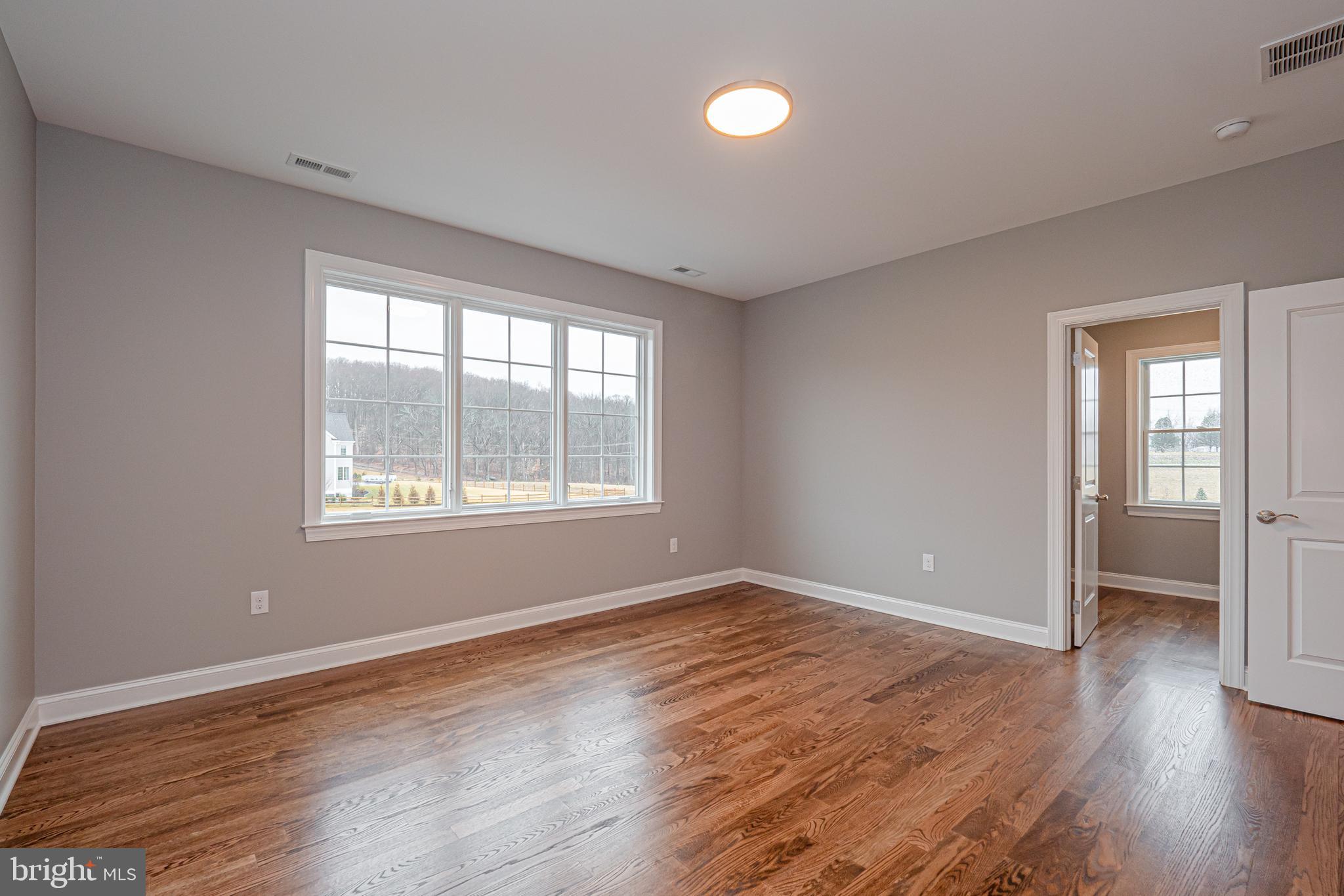 Lot C Howell Road Malvern, PA 19355 - Photo 58 of 61 an empty room with wooden floor and windows