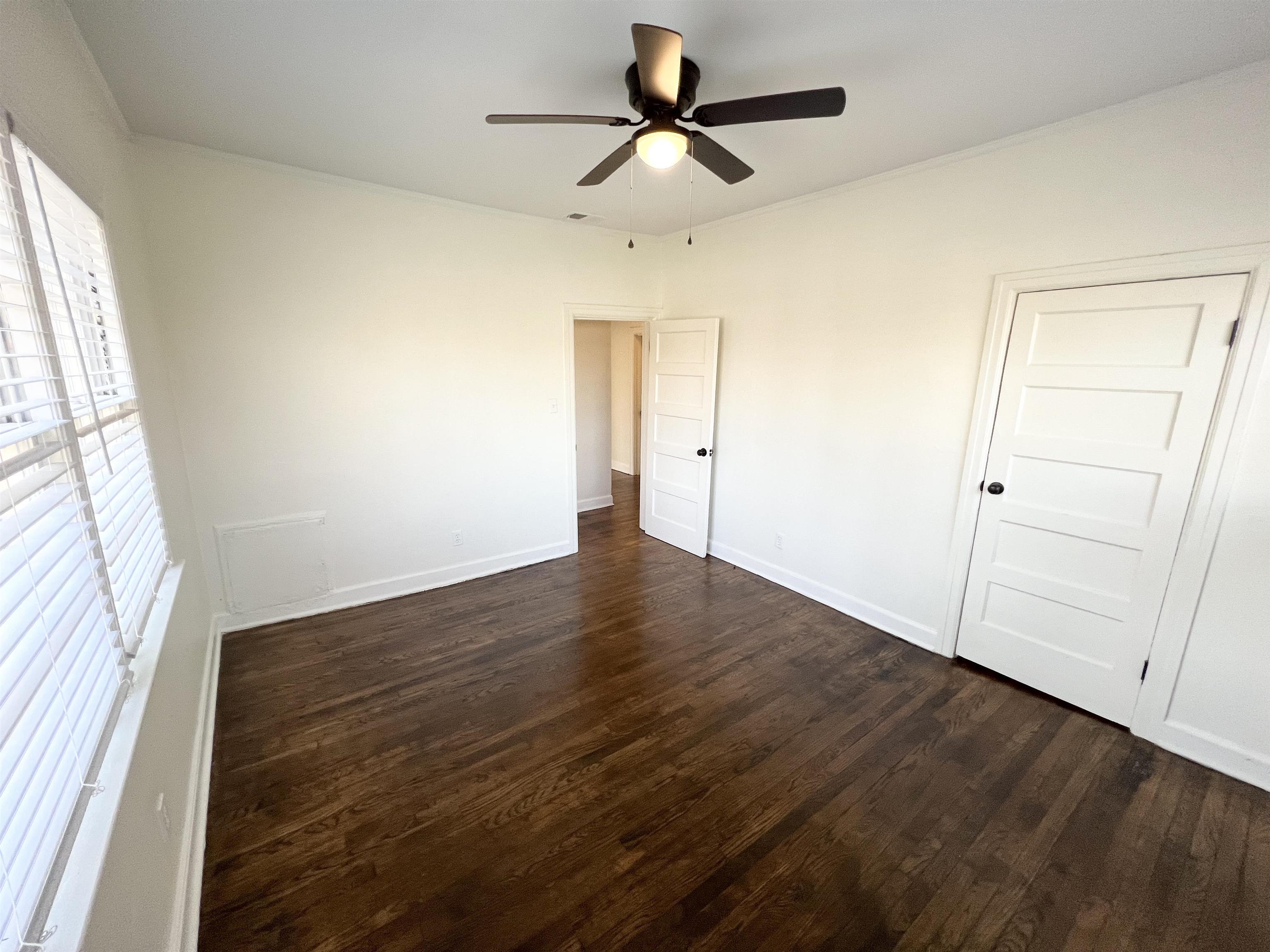 105 West Peebles Road Memphis, TN 38109 - Photo 13 of 15 wooden floor in an empty room with a window
