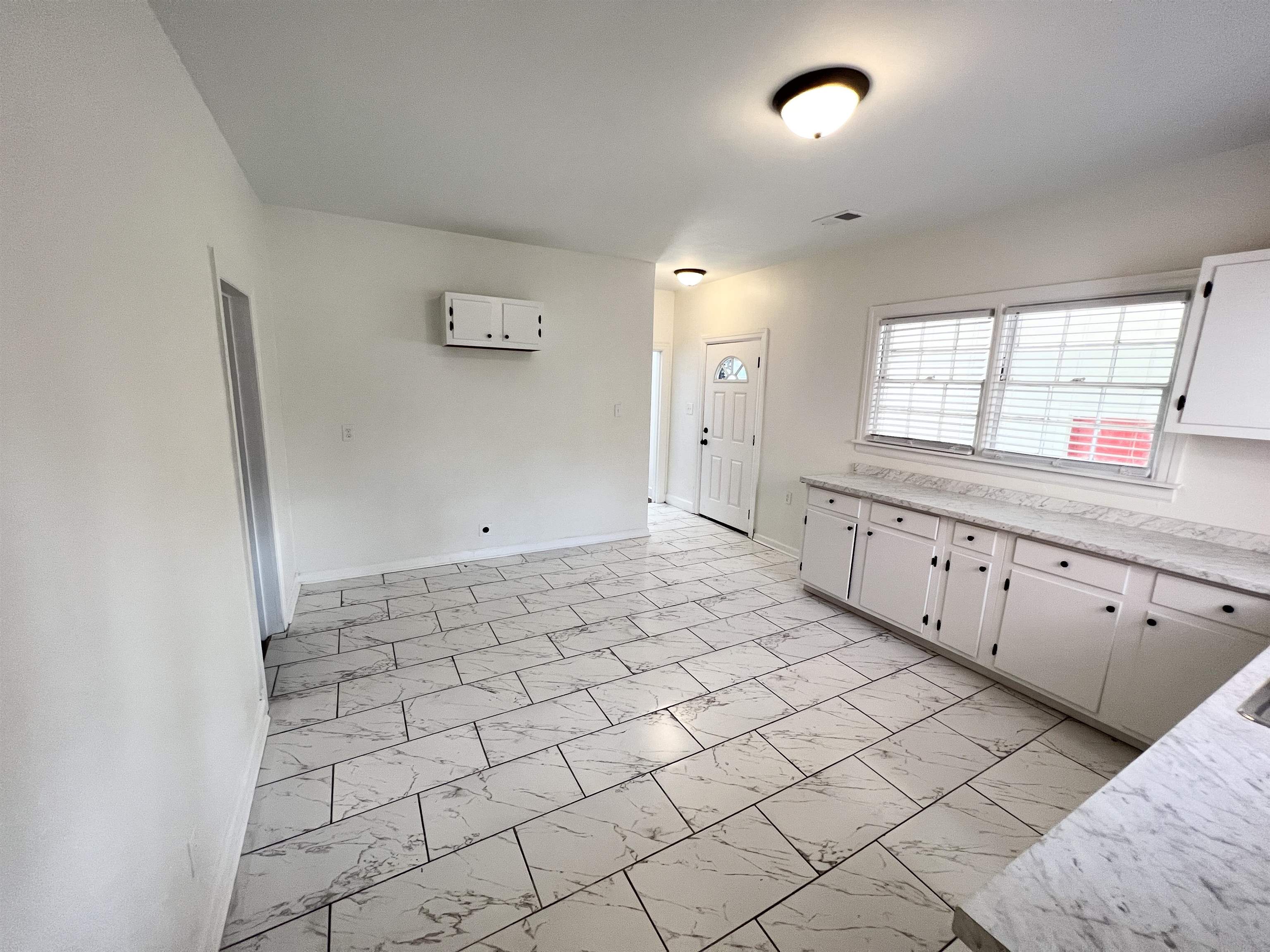 105 West Peebles Road Memphis, TN 38109 - Photo 5 of 15 a large white room with window