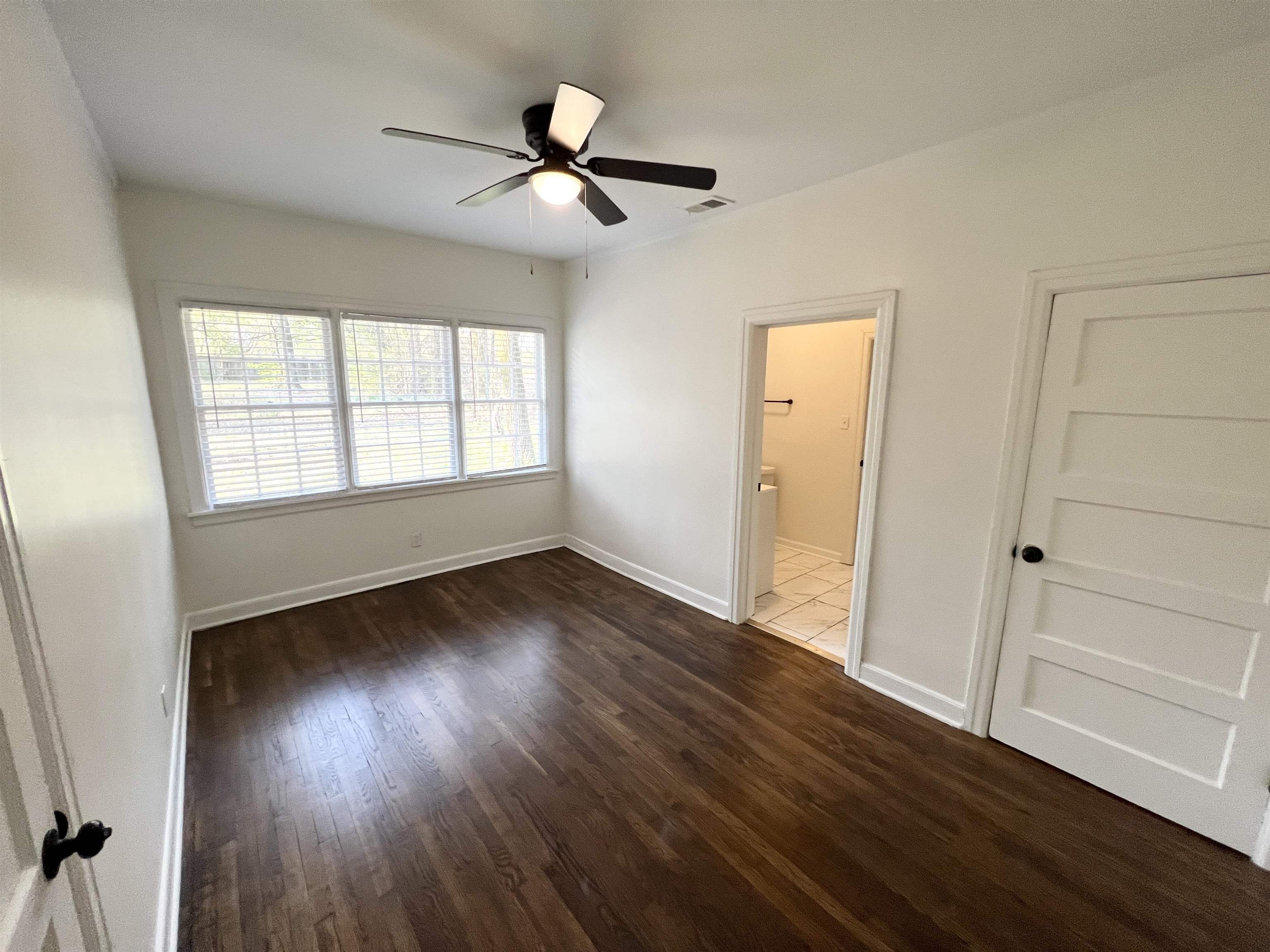105 West Peebles Road Memphis, TN 38109 - Photo 7 of 15 wooden floor in an empty room with a window