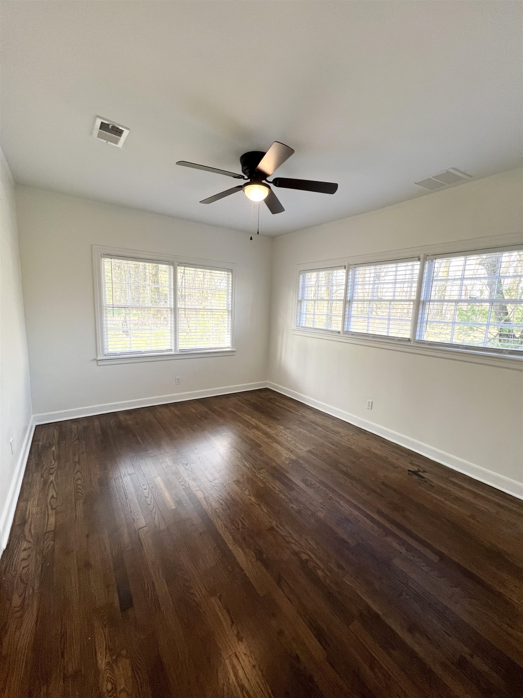 105 West Peebles Road Memphis, TN 38109 - Photo 9 of 15 a view of empty room with wooden floor and fan