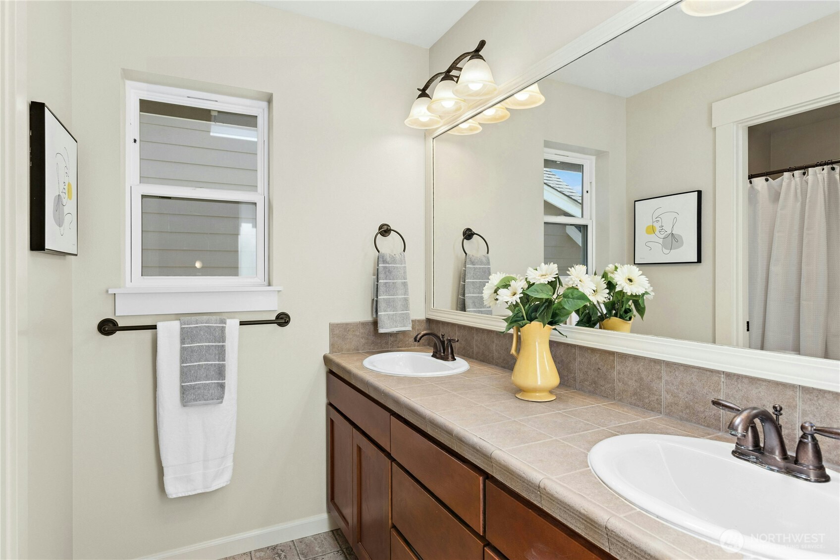 22624 43rd Drive Southeast Bothell, WA 98021 - Photo 24 of 36 a bathroom with a sink a vanity and mirror