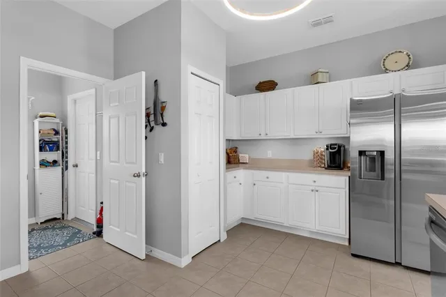 a kitchen with stainless steel appliances granite countertop a sink and a stove