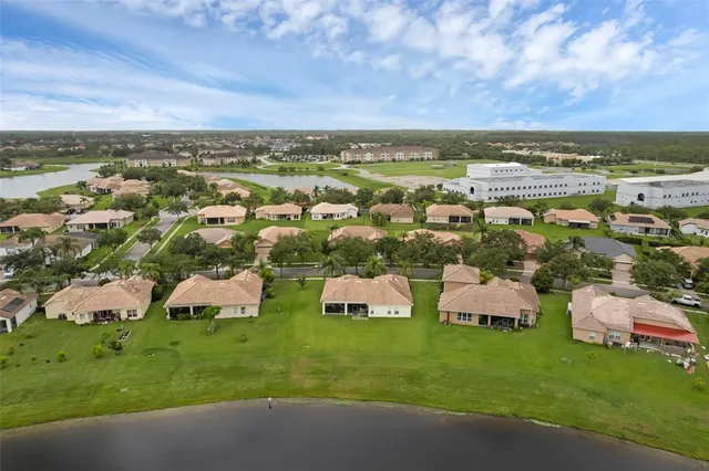 a view of a lake with houses in the back
