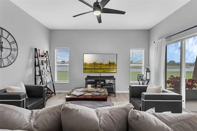 a living room with furniture and a large window