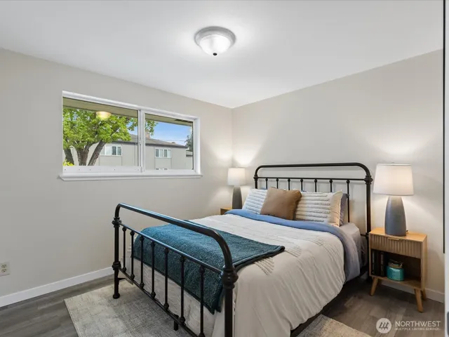 a bedroom with a bed and a window