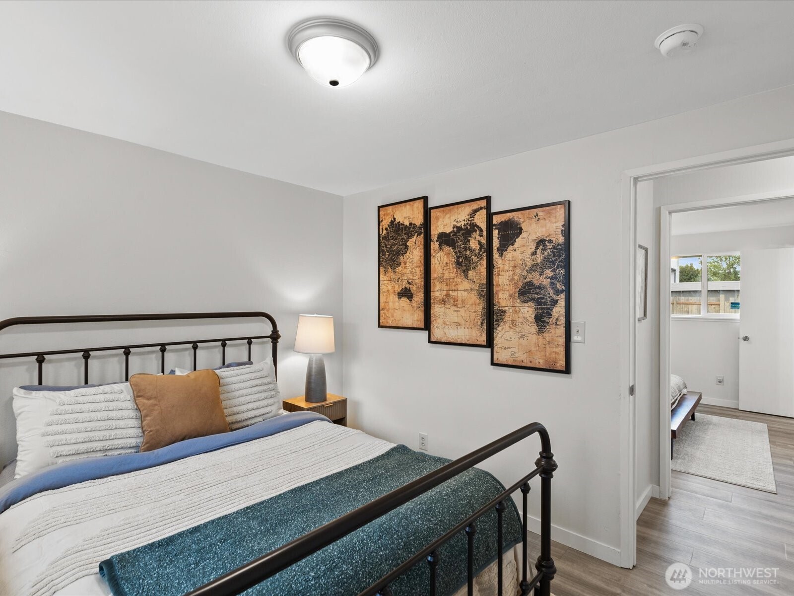 735 F Street Northeast Auburn, WA 98002 - Photo 12 of 31 a bedroom with a bed and wooden floor