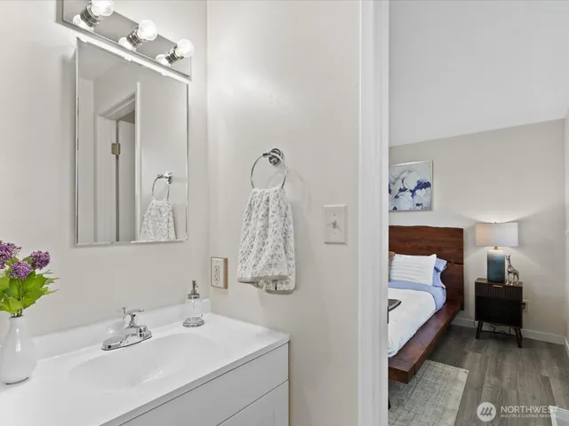 a en suite bathroom with a sink and mirror