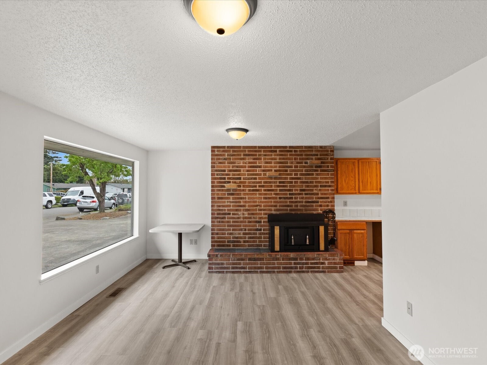 735 F Street Northeast Auburn, WA 98002 - Photo 17 of 31 a living room with furniture and a fireplace