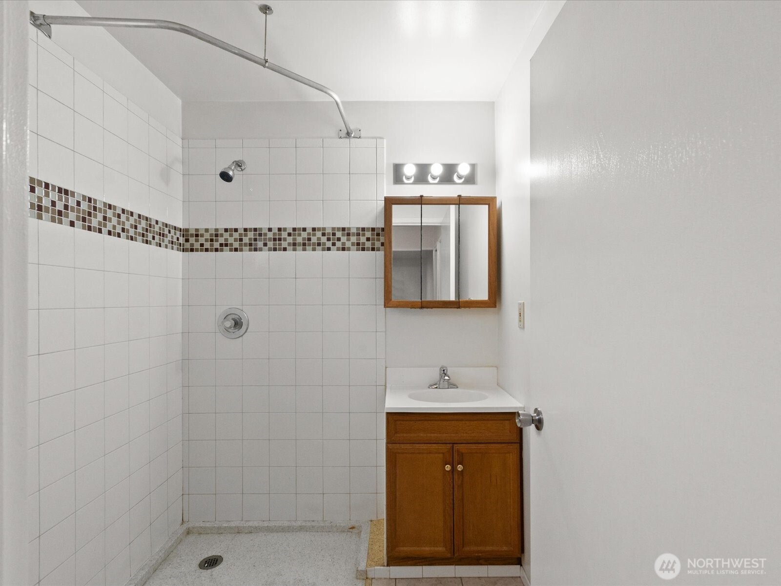 735 F Street Northeast Auburn, WA 98002 - Photo 24 of 31 a bathroom with a sink and a mirror
