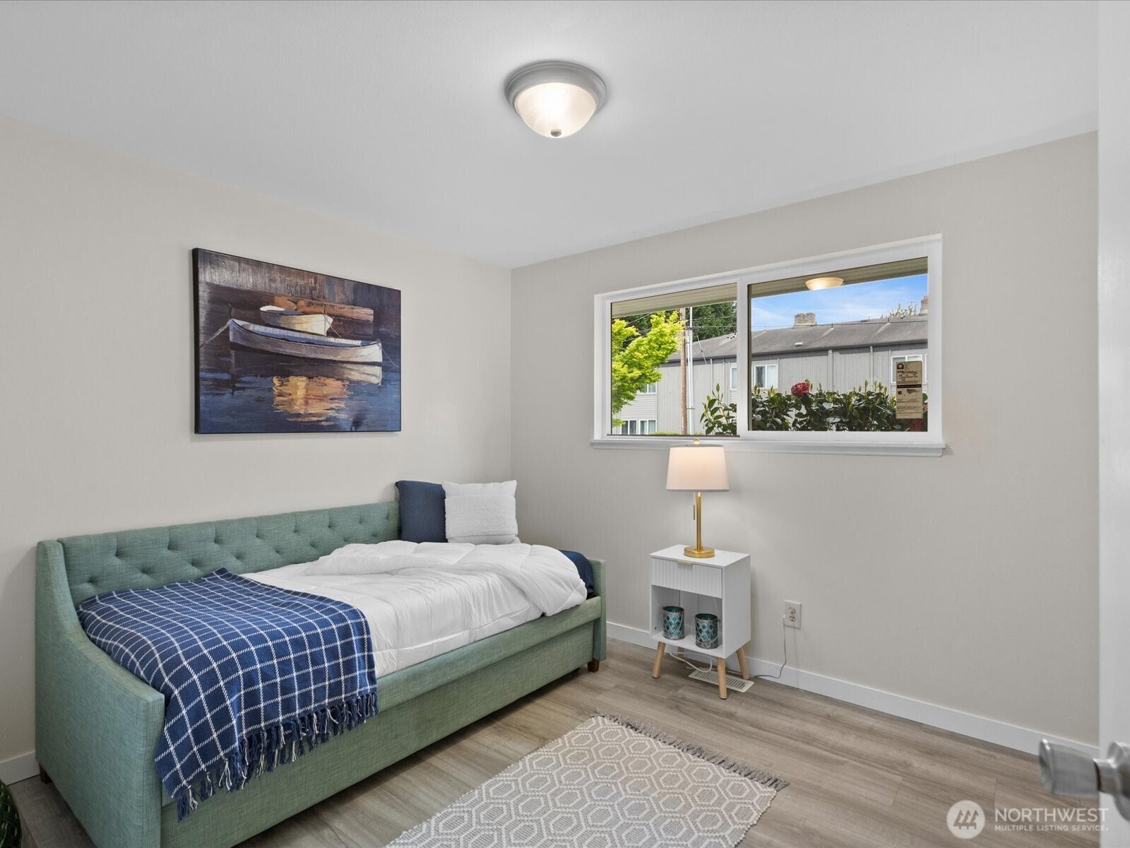 735 F Street Northeast Auburn, WA 98002 - Photo 10 of 31 a bedroom with a bed and a painting on the wall
