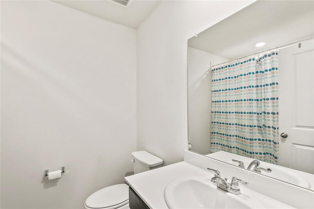 755 Amelia Court Pilot Point, TX 76258 - Photo 19 of 28 a bathroom with a sink toilet and shower