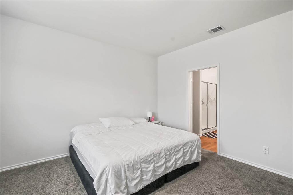 755 Amelia Court Pilot Point, TX 76258 - Photo 22 of 28 a bedroom with a bed and a window