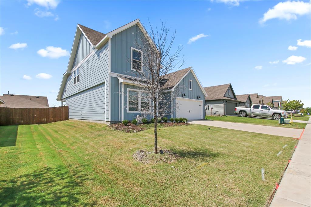755 Amelia Court Pilot Point, TX 76258 - Photo 3 of 28 a front view of a house with a yard