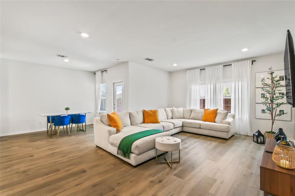 755 Amelia Court Pilot Point, TX 76258 - Photo 6 of 28 a living room with furniture and wooden floor