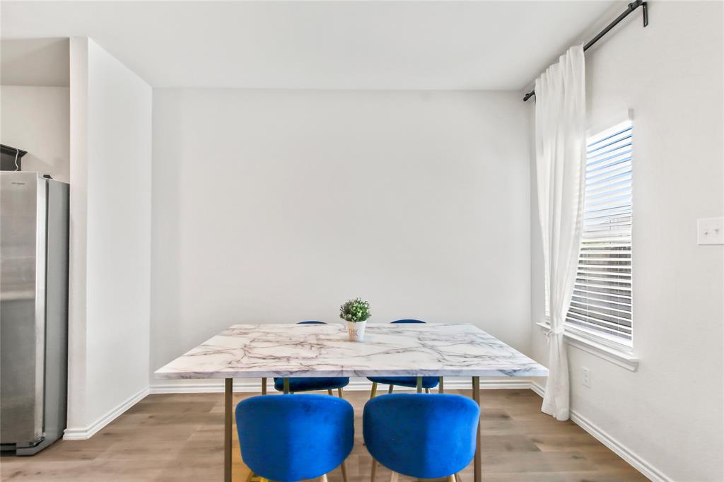 755 Amelia Court Pilot Point, TX 76258 - Photo 8 of 28 a dining table with chairs and window