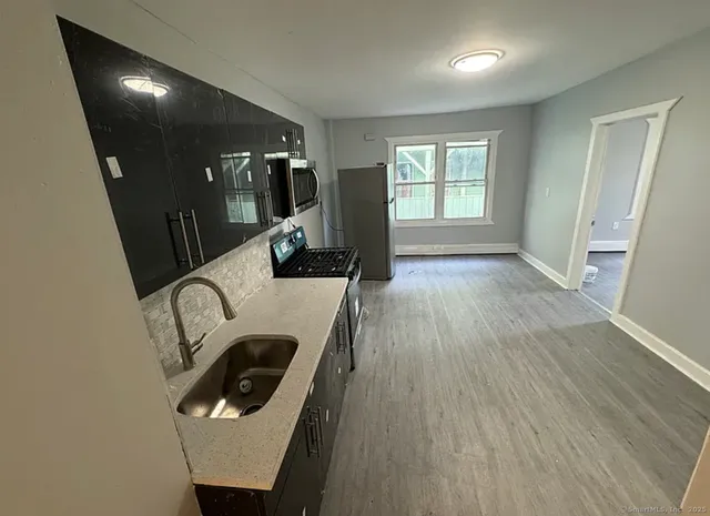 a room with wooden floor and furniture