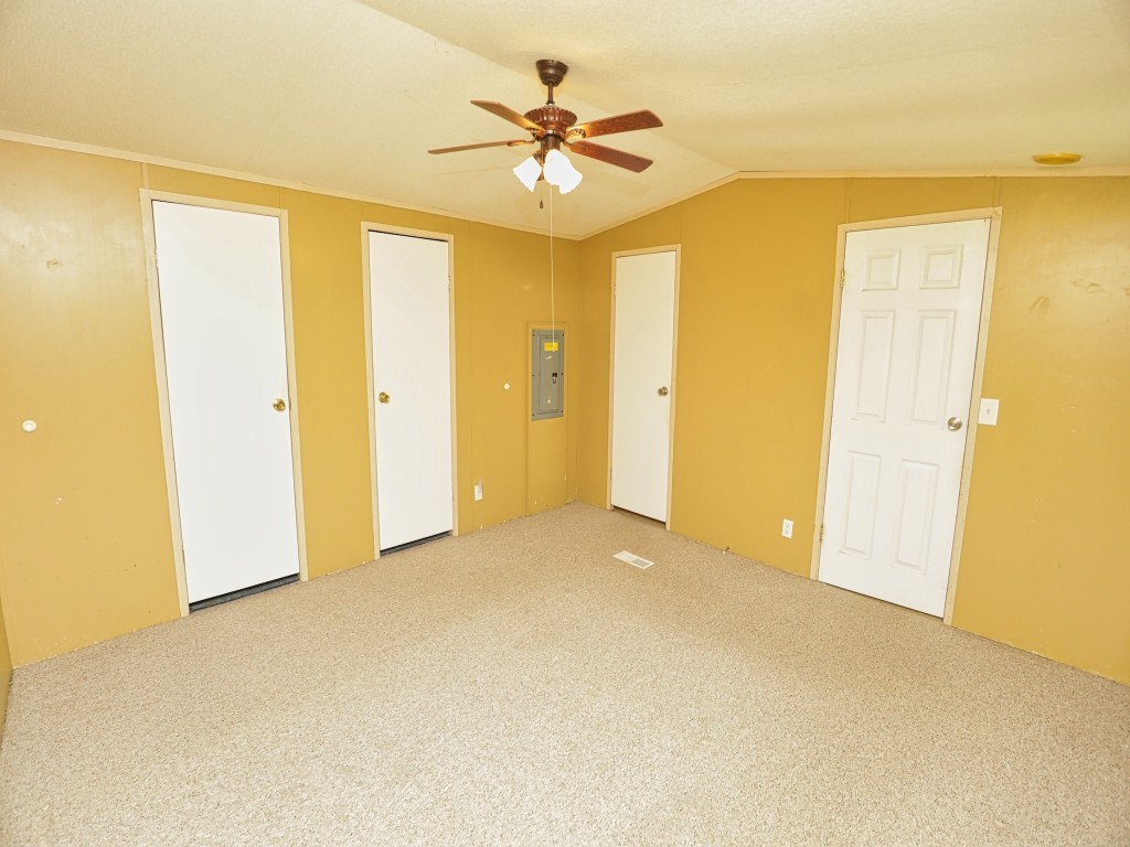 210 Floyd Street Boling, TX 77420 - Photo 20 of 29 a view of an empty room with a ceiling fan