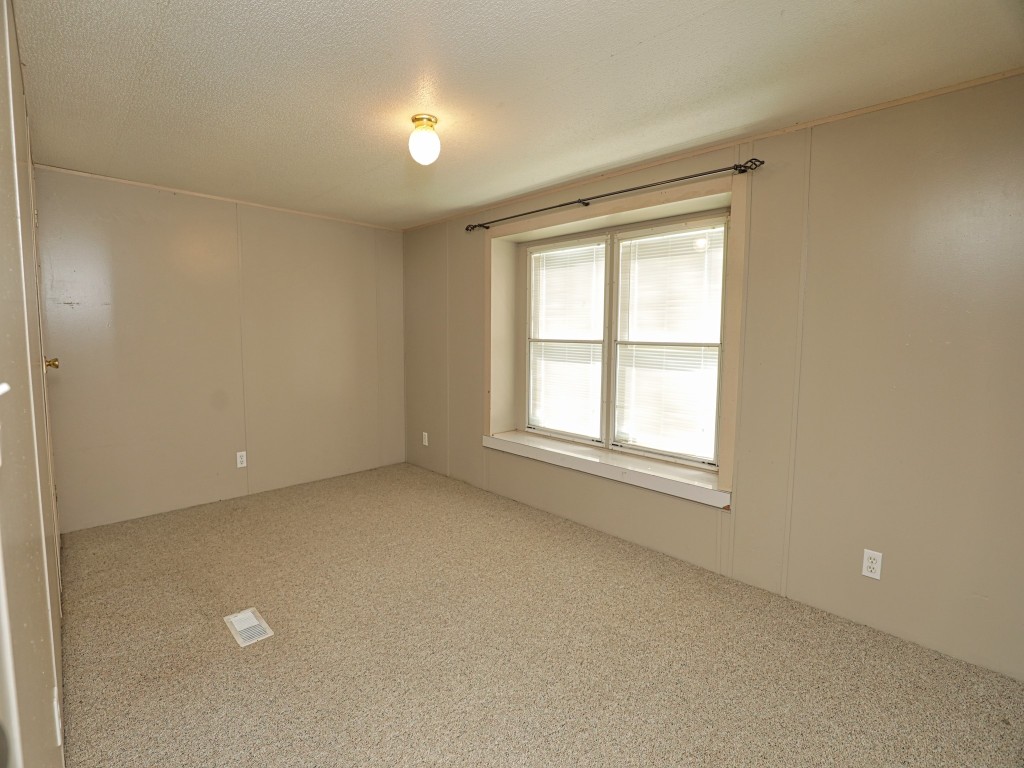 210 Floyd Street Boling, TX 77420 - Photo 24 of 29 an empty room with a window
