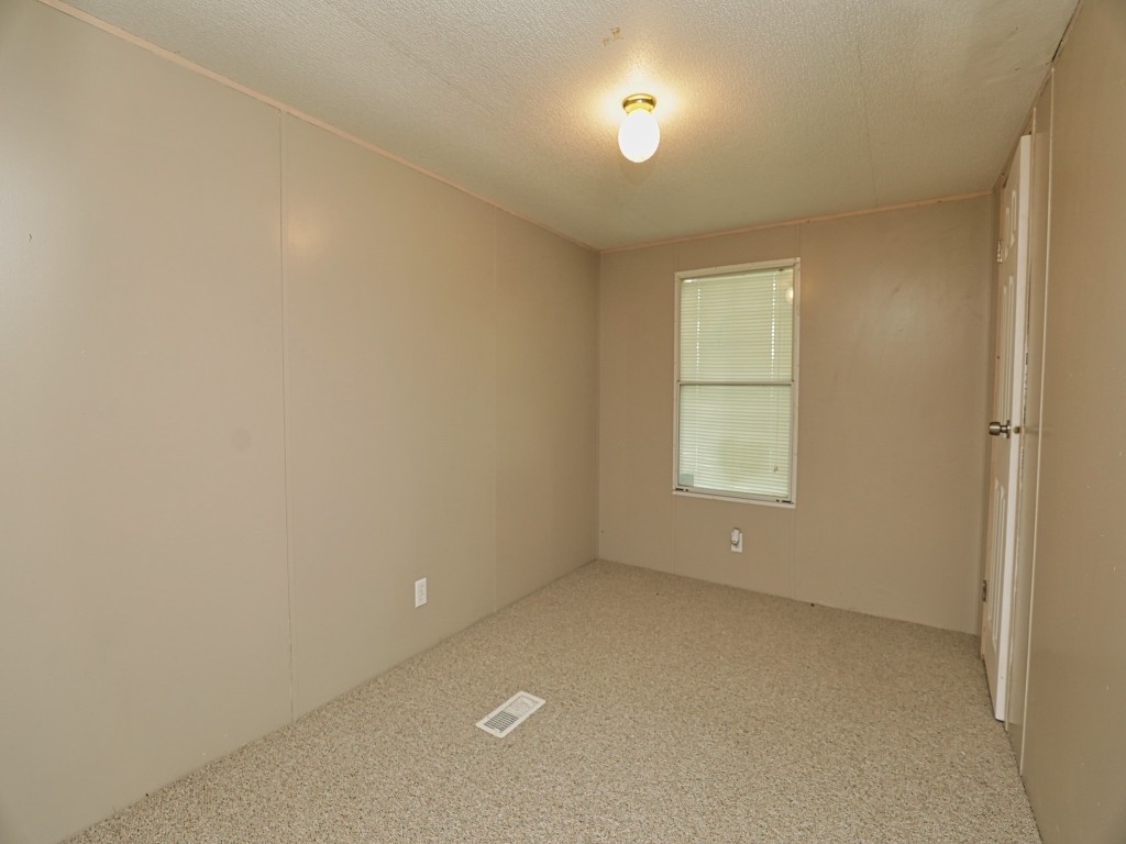 210 Floyd Street Boling, TX 77420 - Photo 28 of 29 an empty room with a window