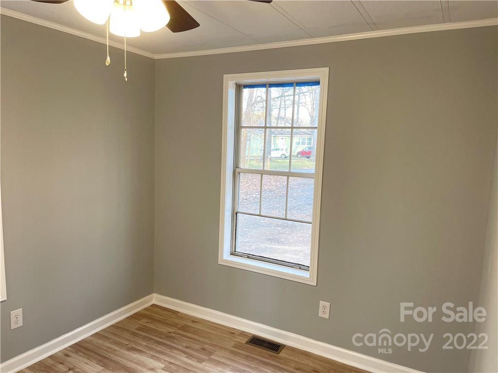 2209 Sunset Boulevard Charlotte, NC 28269 - Photo 11 of 17 an empty room with windows