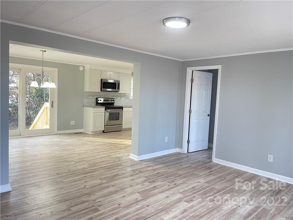 2209 Sunset Boulevard Charlotte, NC 28269 - Photo 14 of 17 a view of a kitchen cabinets and wooden floor