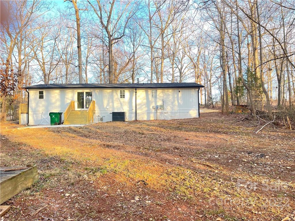 2209 Sunset Boulevard Charlotte, NC 28269 - Photo 16 of 17 front view of a house with a yard and trees