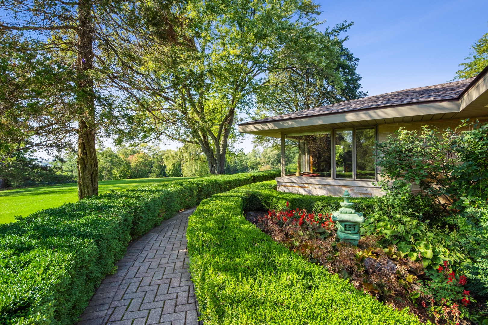 126 Brinker Road Barrington Hills, IL 60010 - Photo 2 of 31 a front view of a house with a yard