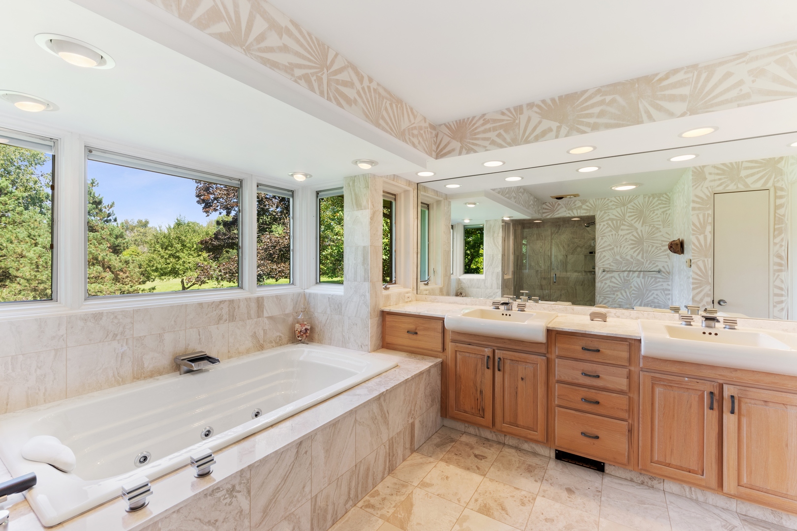 126 Brinker Road Barrington Hills, IL 60010 - Photo 18 of 31 a spacious bathroom with a double vanity sink large mirror and a bathtub