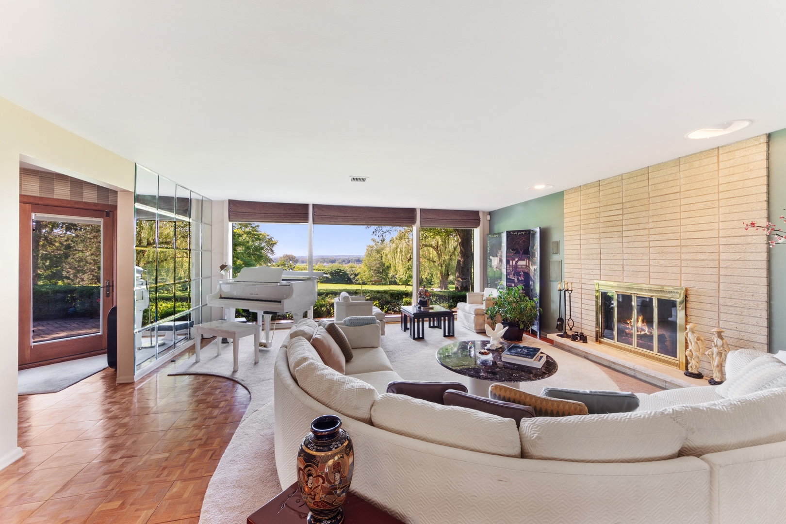126 Brinker Road Barrington Hills, IL 60010 - Photo 3 of 31 a living room with fireplace furniture and a large window