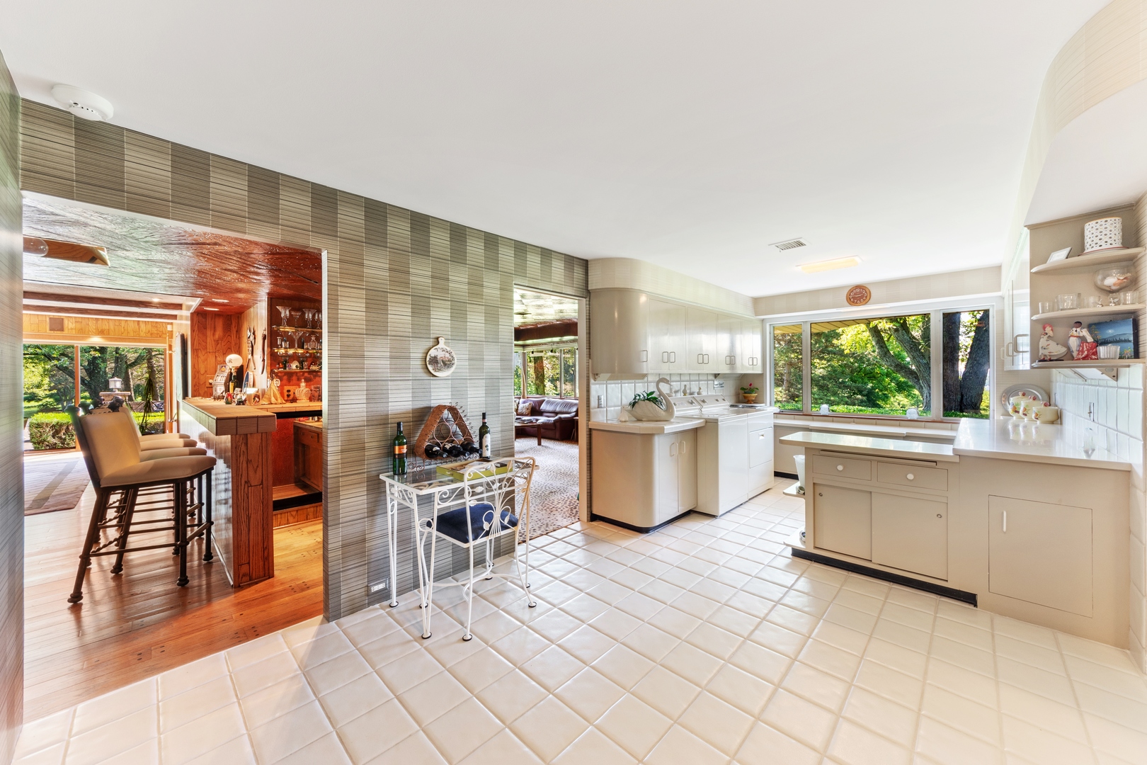126 Brinker Road Barrington Hills, IL 60010 - Photo 24 of 31 a kitchen with stainless steel appliances kitchen island granite countertop a stove a sink and white cabinets with wooden floor